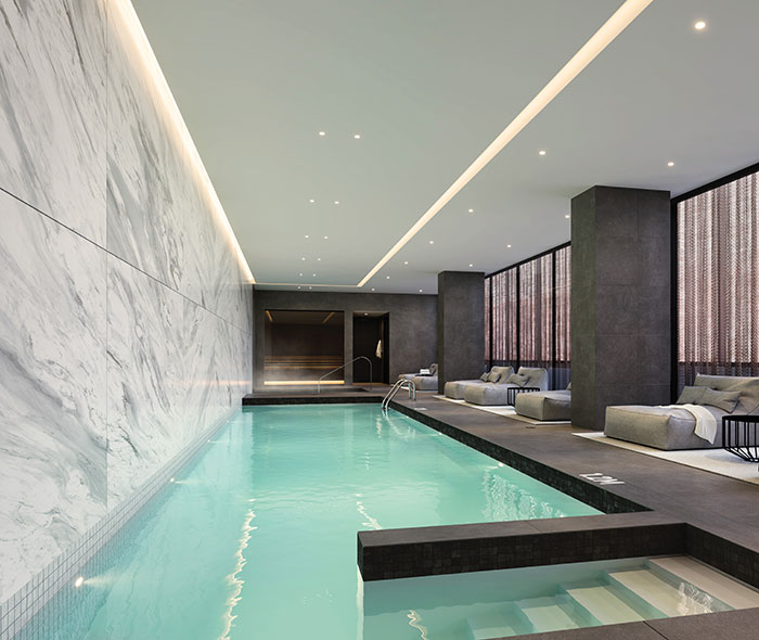 Indoor swimming pool of the project of new condos for sale in Montreal at 1 Square Phillips