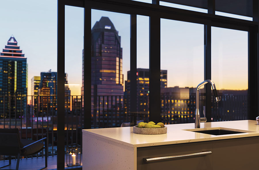 Kitchen of a luxury condo with a view of downtown Montreal